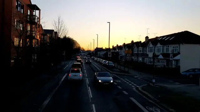 Time-lapse of traffic on a London street at sunset.