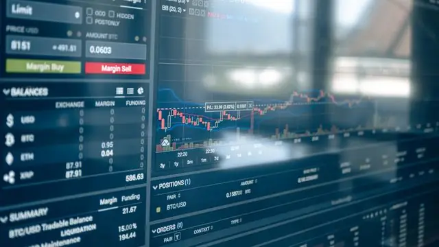 Close-up of a digital screen showing stock trading graphs.